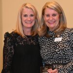 Dulles Area Association of Realtors President Phyllis Stakem handing a plaque to Holly Weather