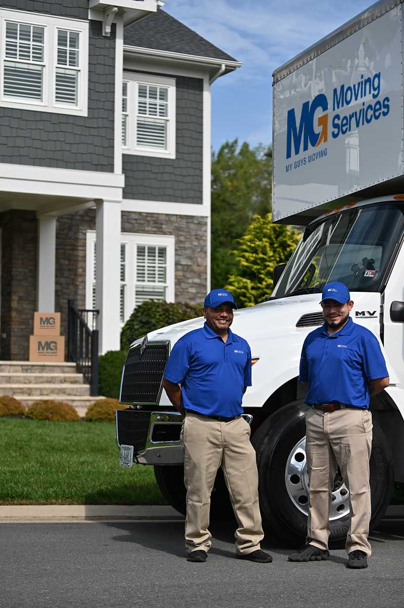 movers-by-truck-in-front-of-house